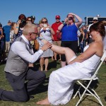 Bend-Brewfest-2015-groom-removes-garter-belt-with-teeth